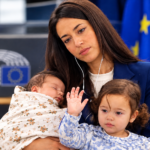 Licia Ronzulli holding her daughter at the European Parliament