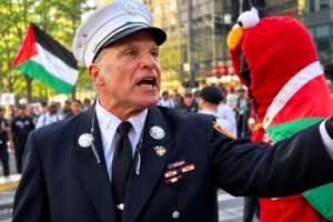 Firefighter confronting a pro-Palestinian protester near Ground Zero during a 9/11 anniversary