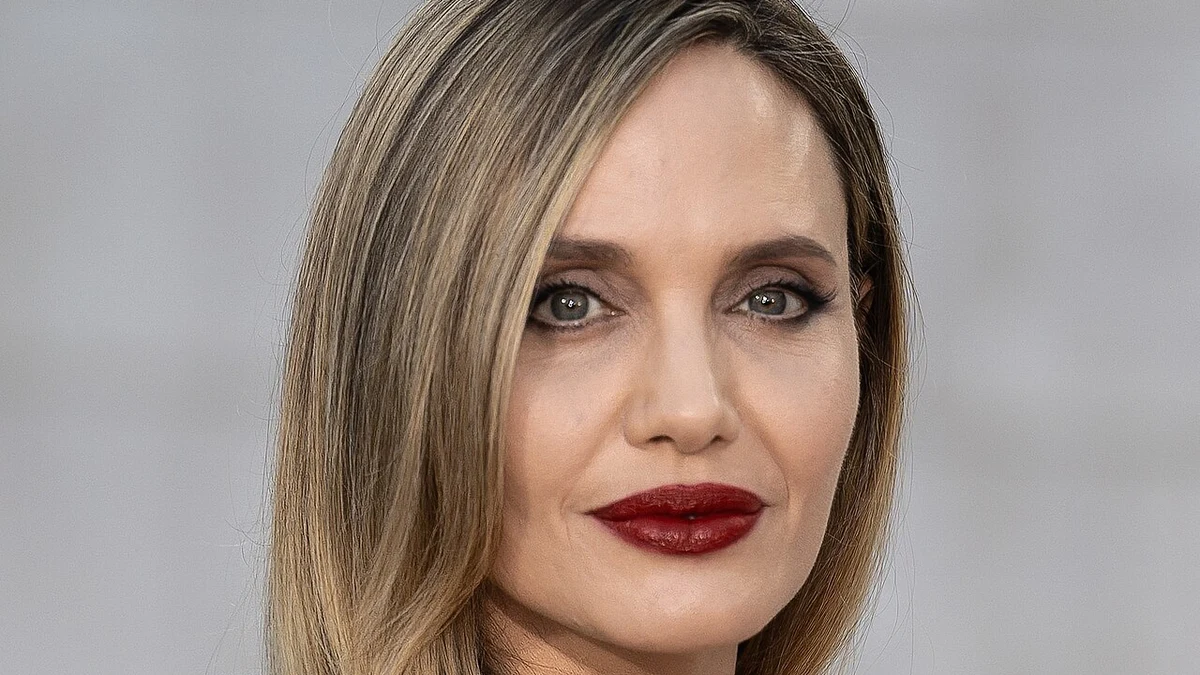 Poised, strong, and serene portrait of Angelina Jolie looking forward to her creative and personal future