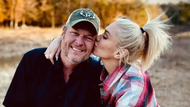 Gwen Stefani and Blake Shelton celebrating her birthday with a personalized gift